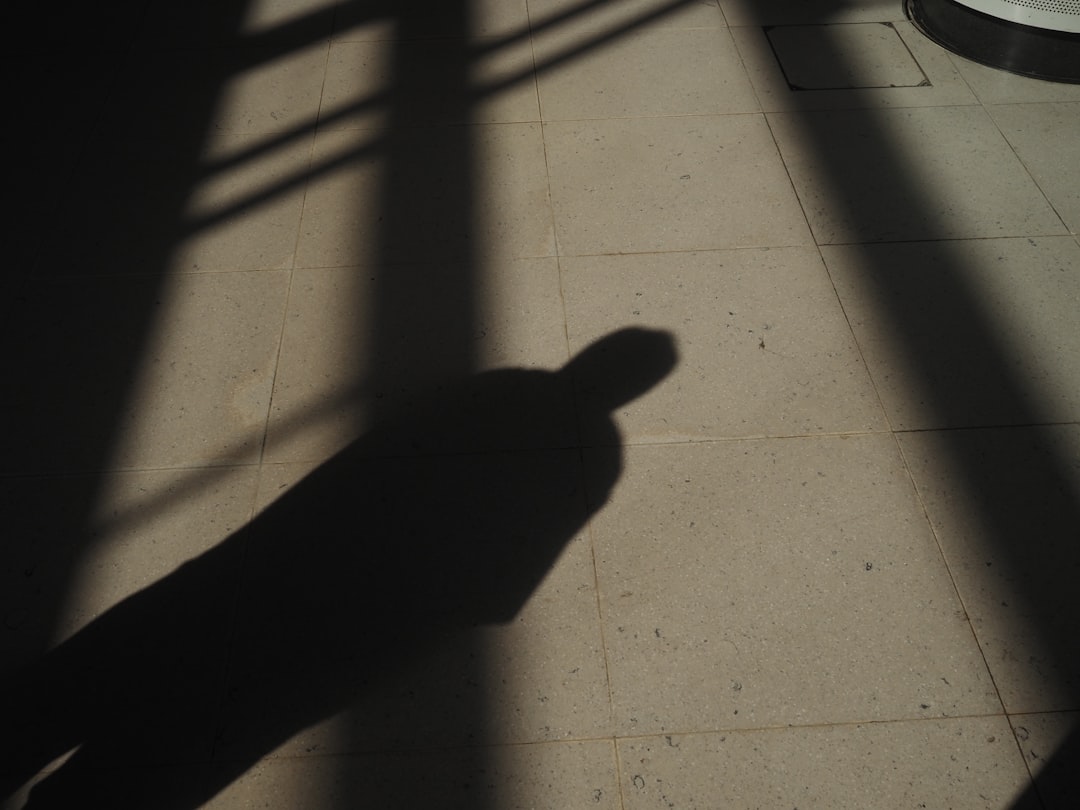 person standing on white floor tiles