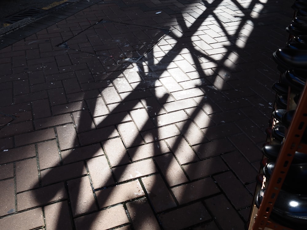 black metal fence on brown brick floor