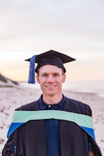 man in academic dress and academic hat
