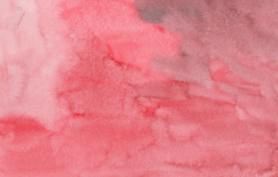 Gentle pastel pink and cream watercolor washes blending smoothly on textured paper.