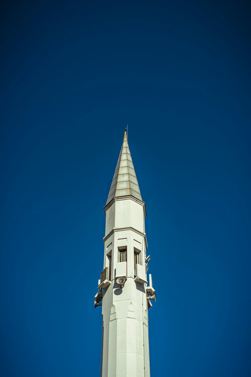 white concrete building under blue sky during daytime