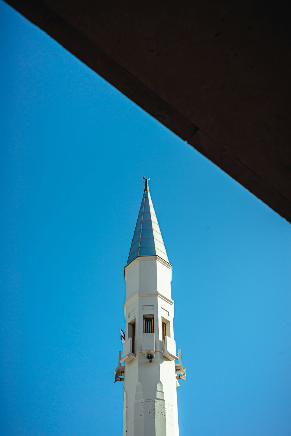 white and brown concrete building under blue sky during daytime