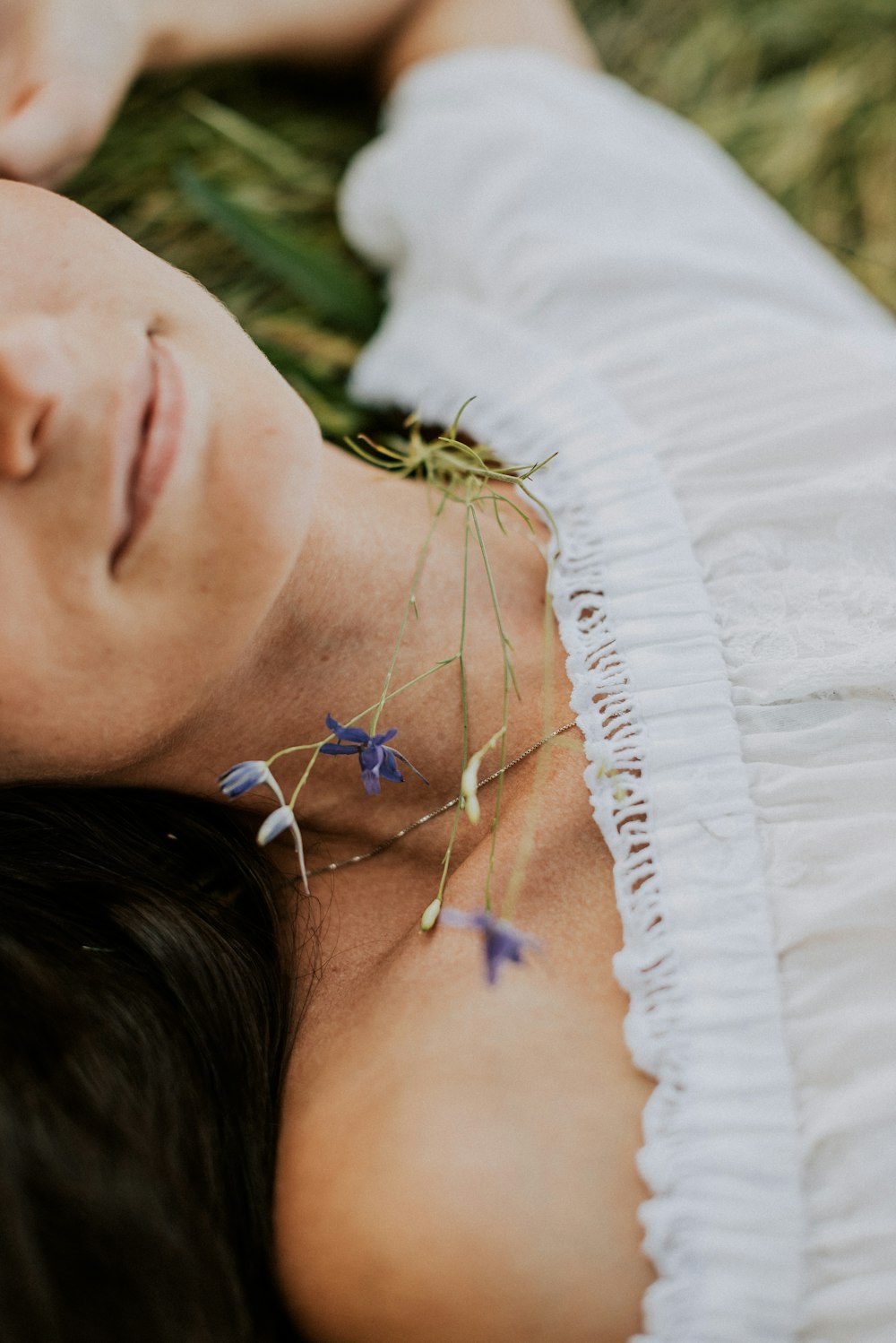 woman in white shirt wearing silver necklace