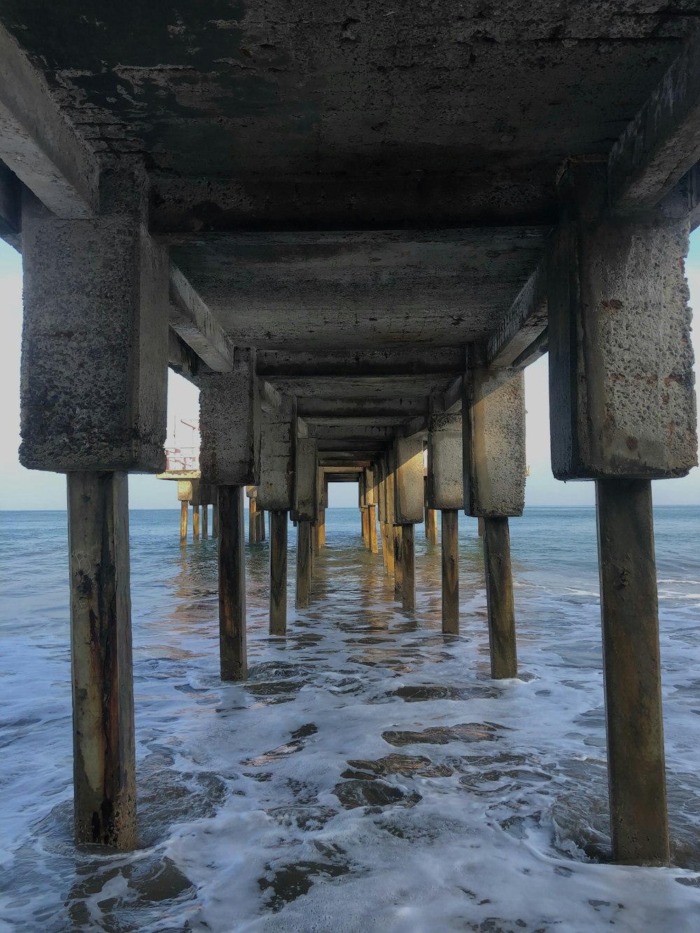 brown wooden dock on sea during daytime