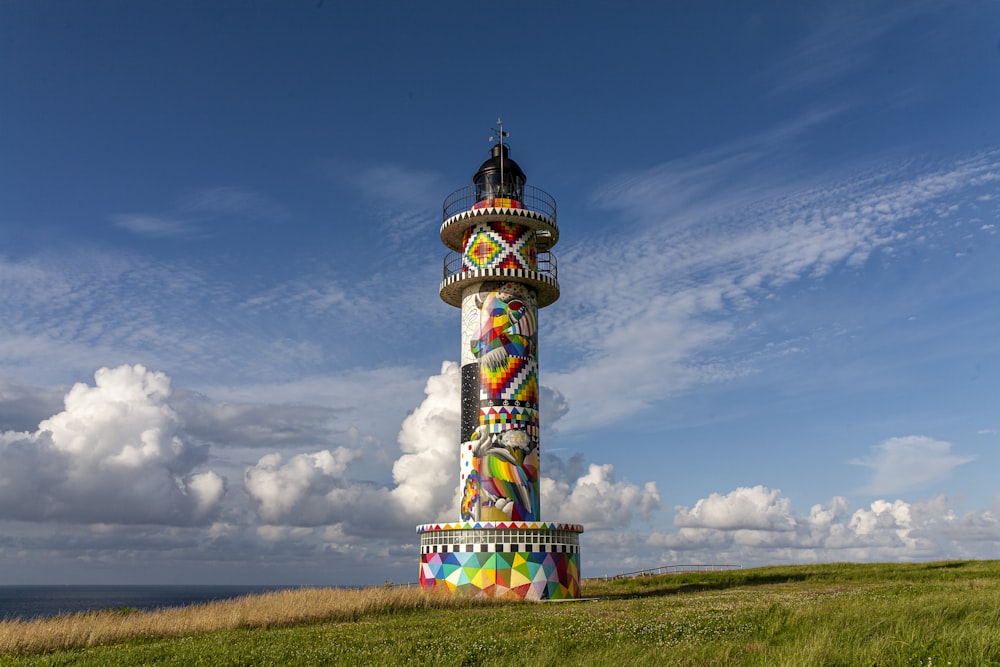 white and purple tower under blue sky