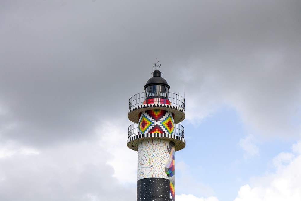 white and red tower under white clouds