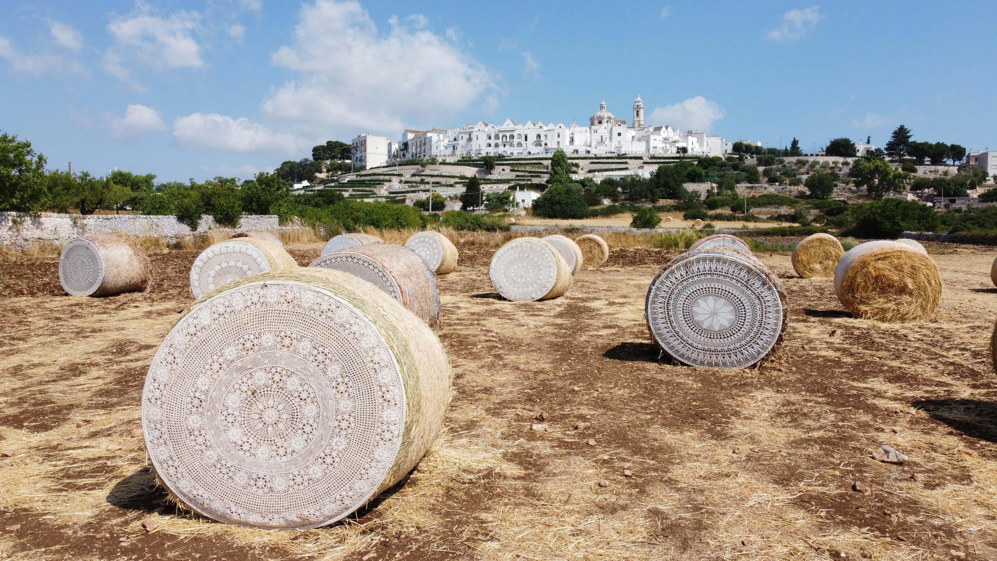 brown and white concrete building under blue sky during daytime, Puglia 
