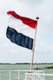 red and black flag on pole