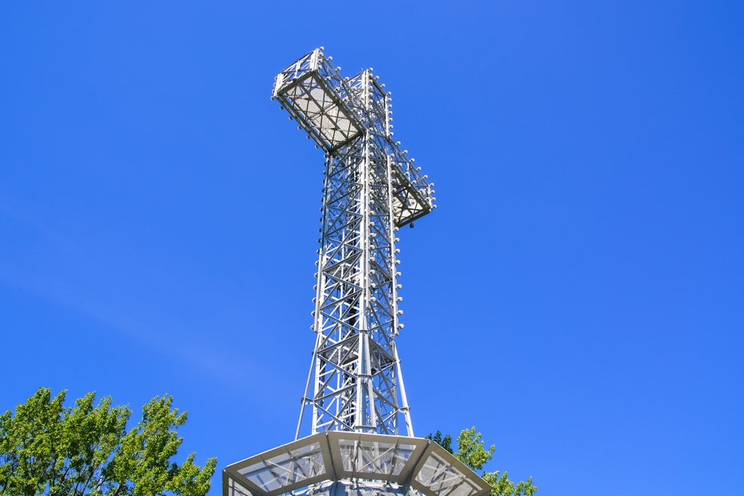 gray metal tower under blue sky during daytime