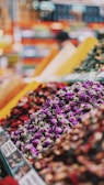 A vibrant market scene with colorful fresh produce and spices.
