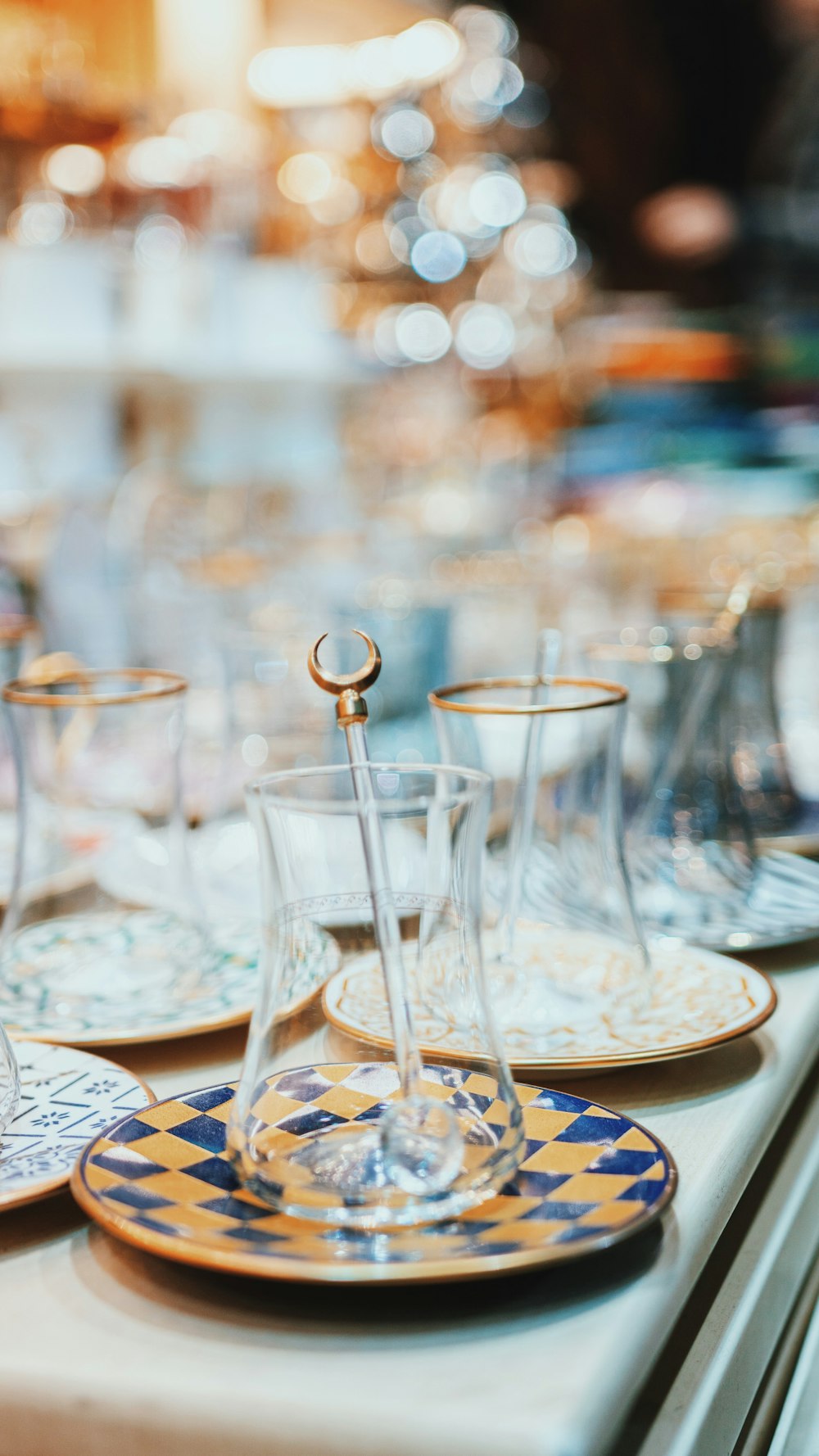 clear glass cups on white ceramic plate