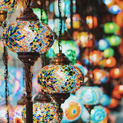 selective focus photography of blue and yellow floral pendant lamp