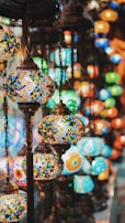 selective focus photography of blue and yellow floral pendant lamp