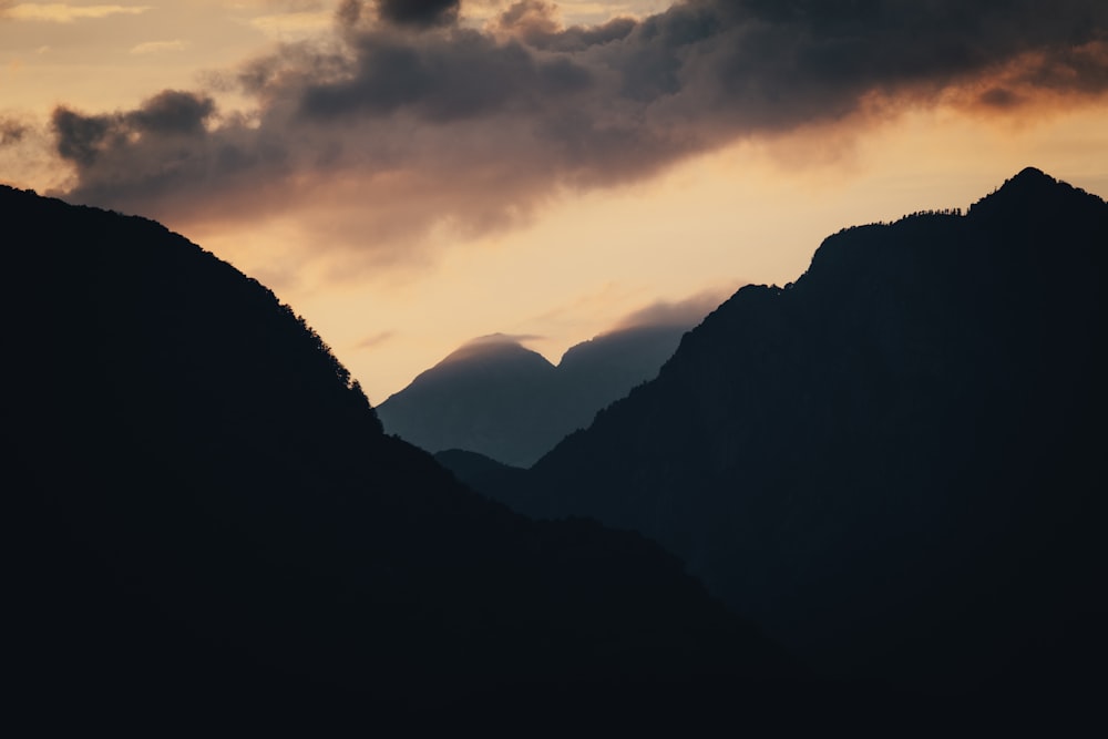 silhouette of mountains during sunset