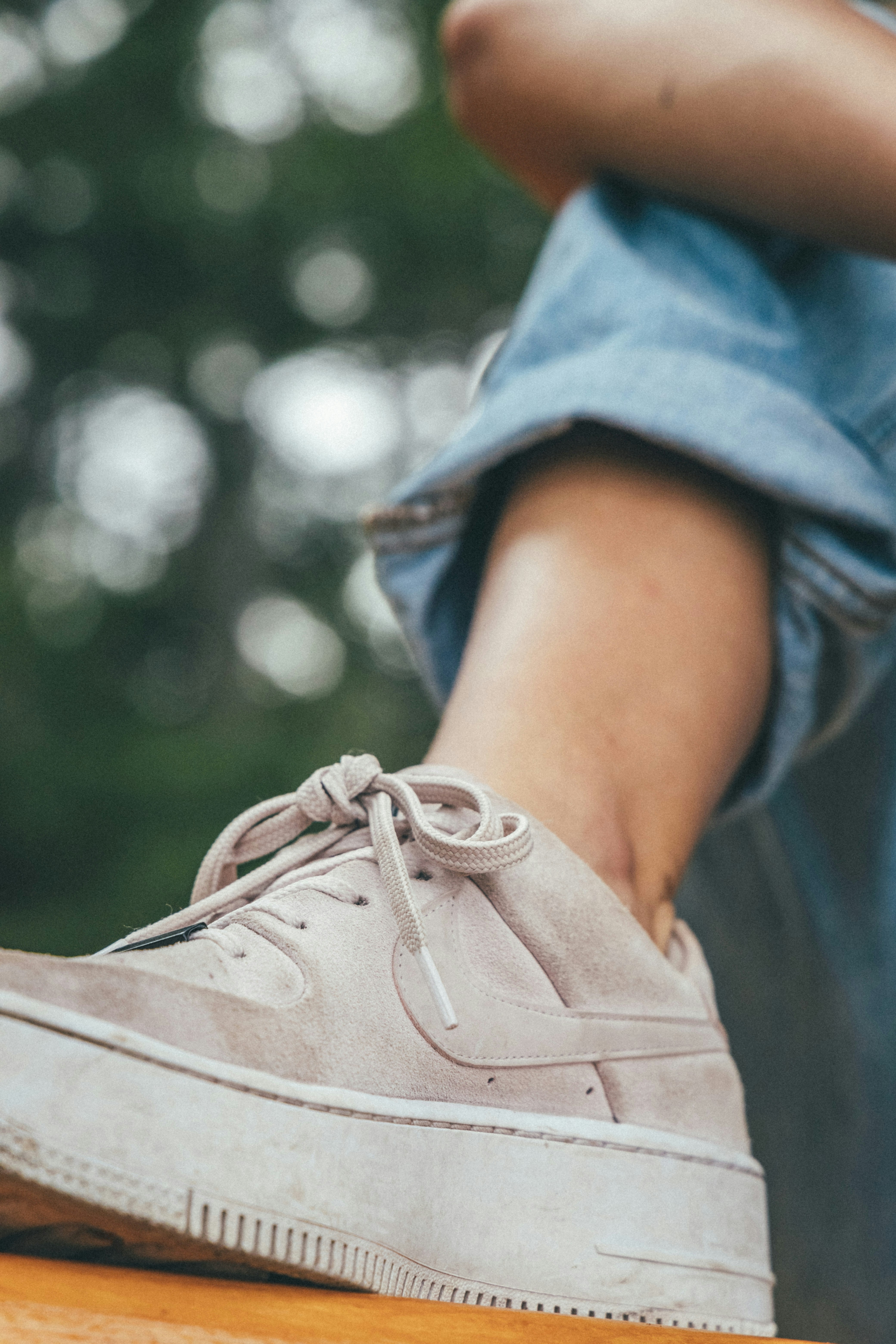 person wearing brown leather lace up shoe