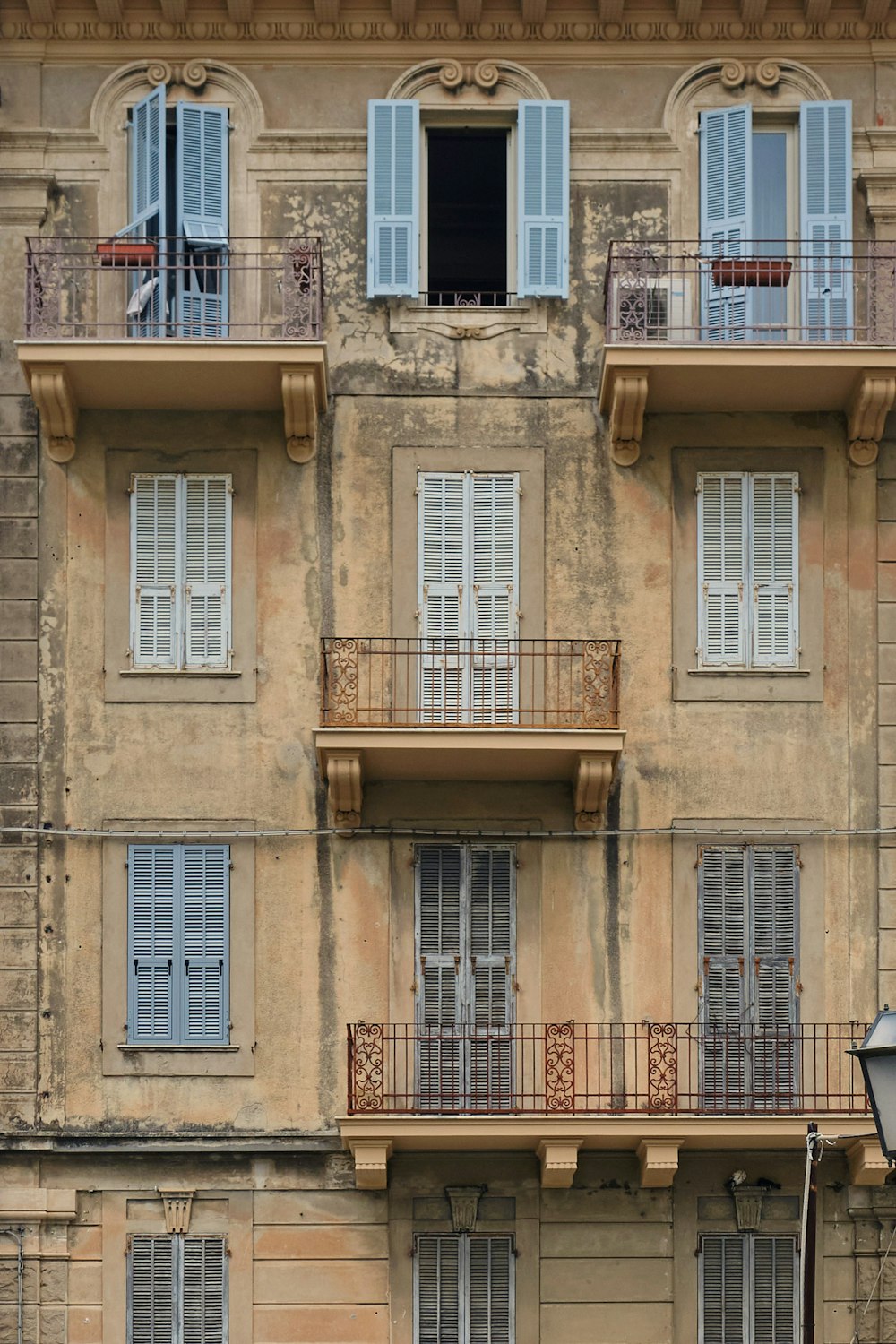beige concrete building with windows