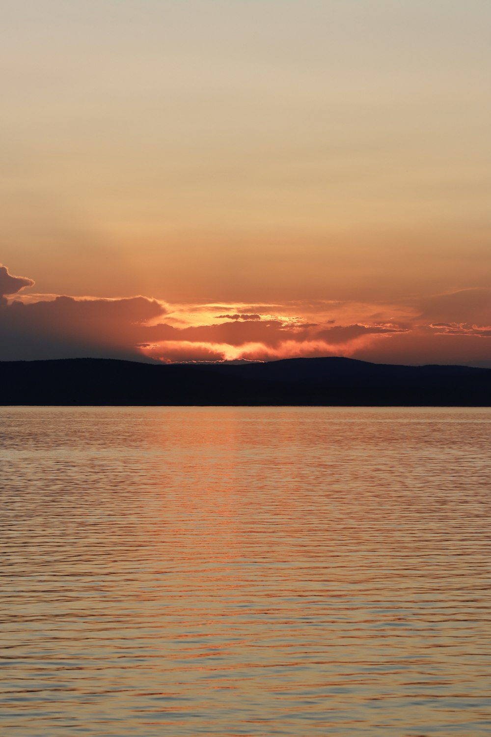 body of water during sunset