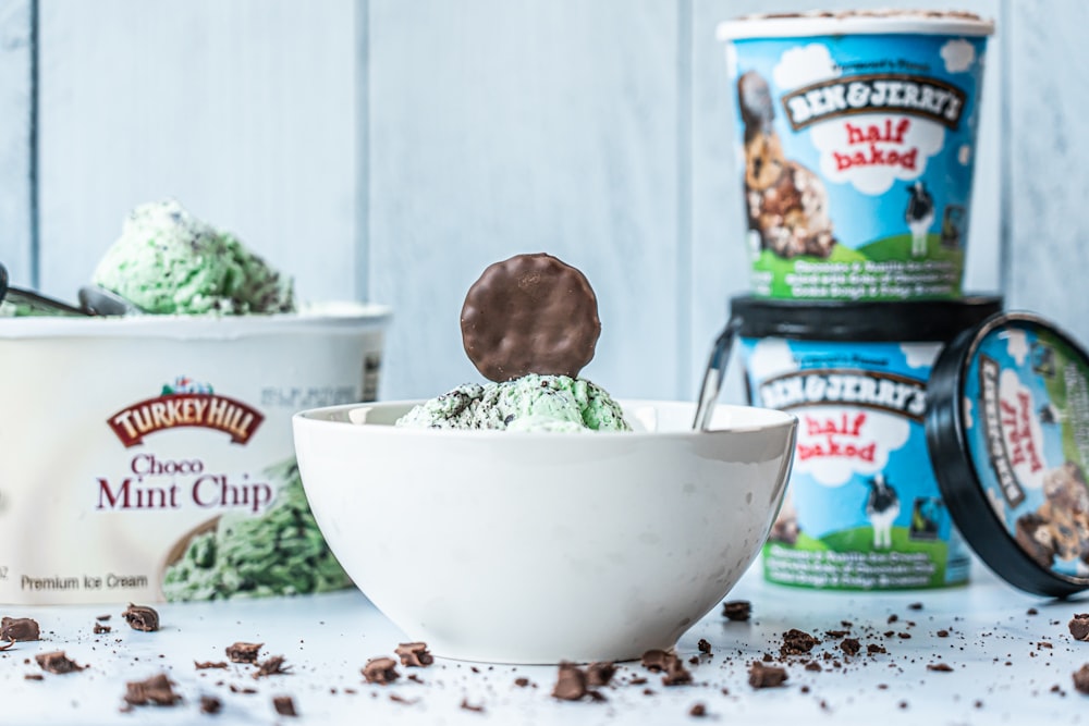 green and brown ice cream in white ceramic bowl