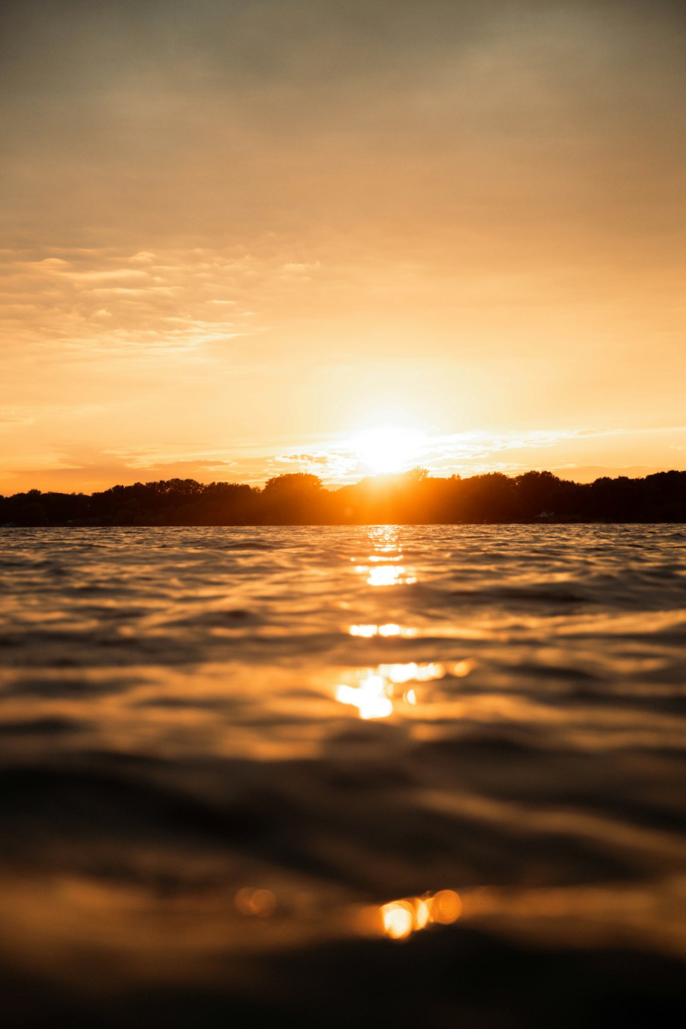 body of water during sunset