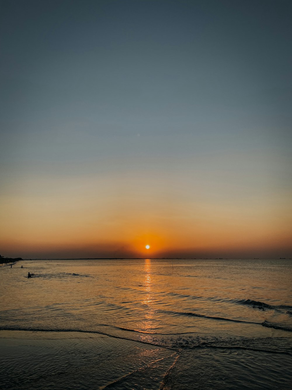 body of water during sunset