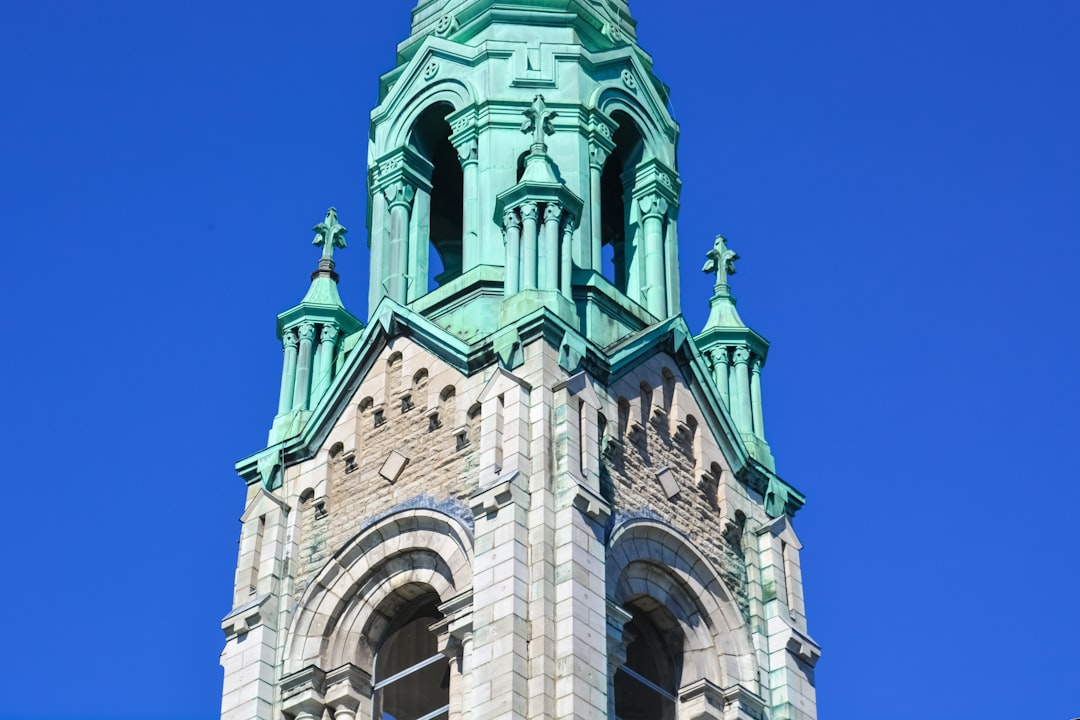 gray concrete church under blue sky during daytime