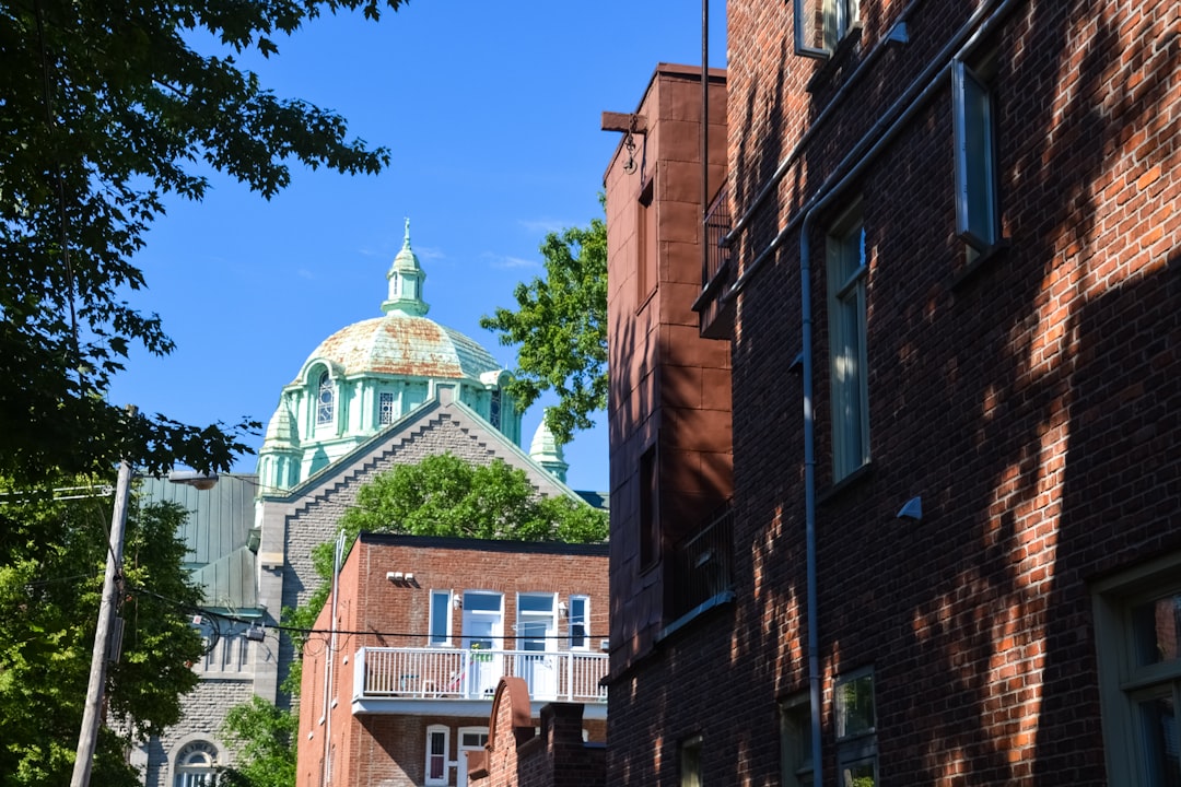 brown brick building under blue sky during daytime