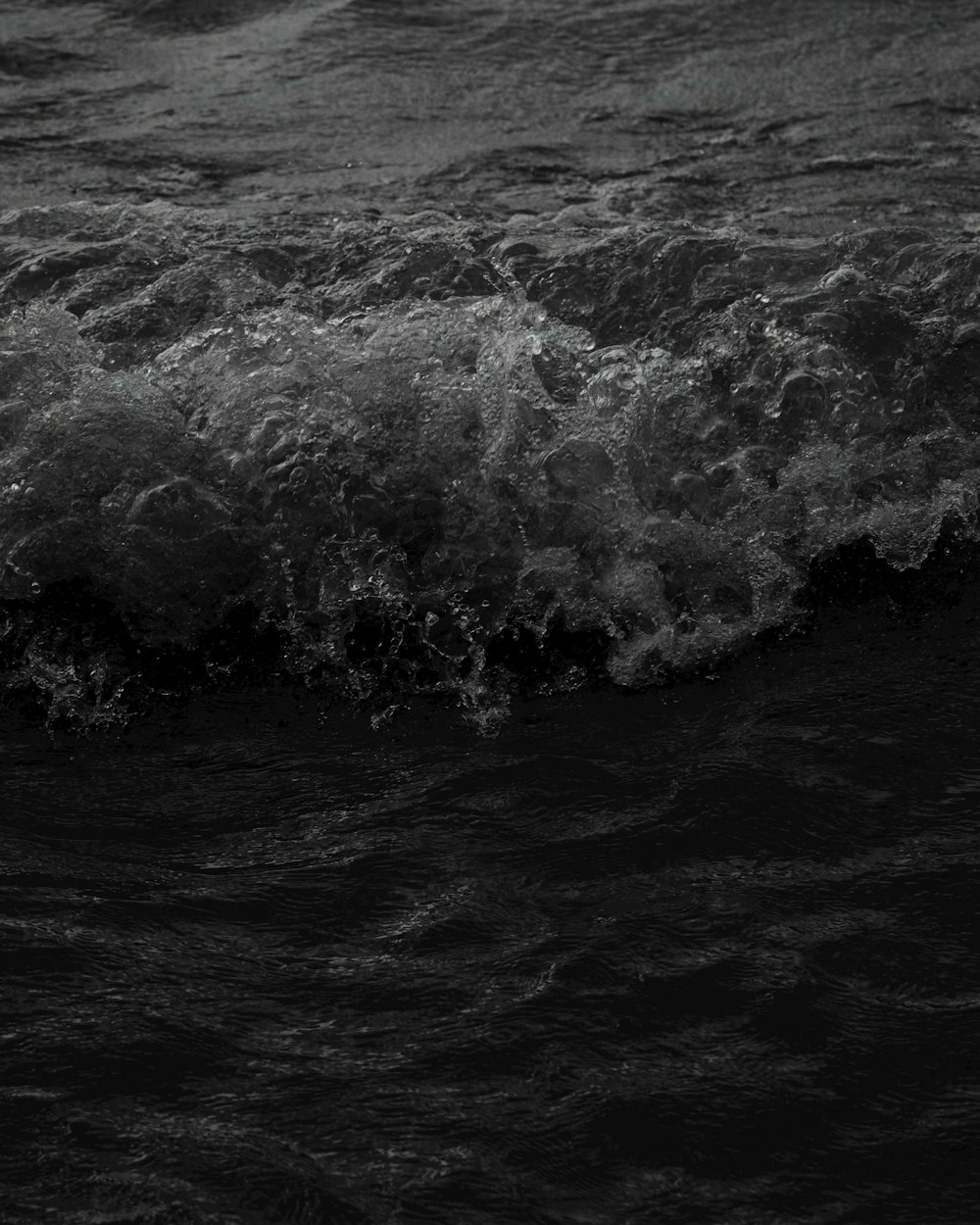 grayscale photo of water waves