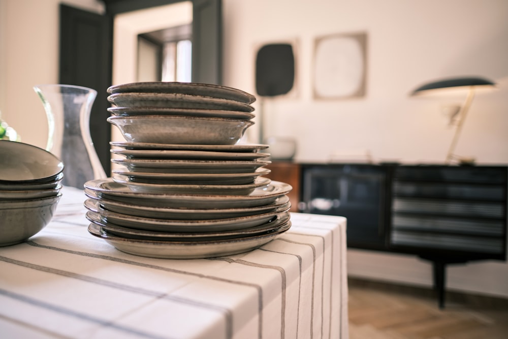 stack of silver round coins on white table