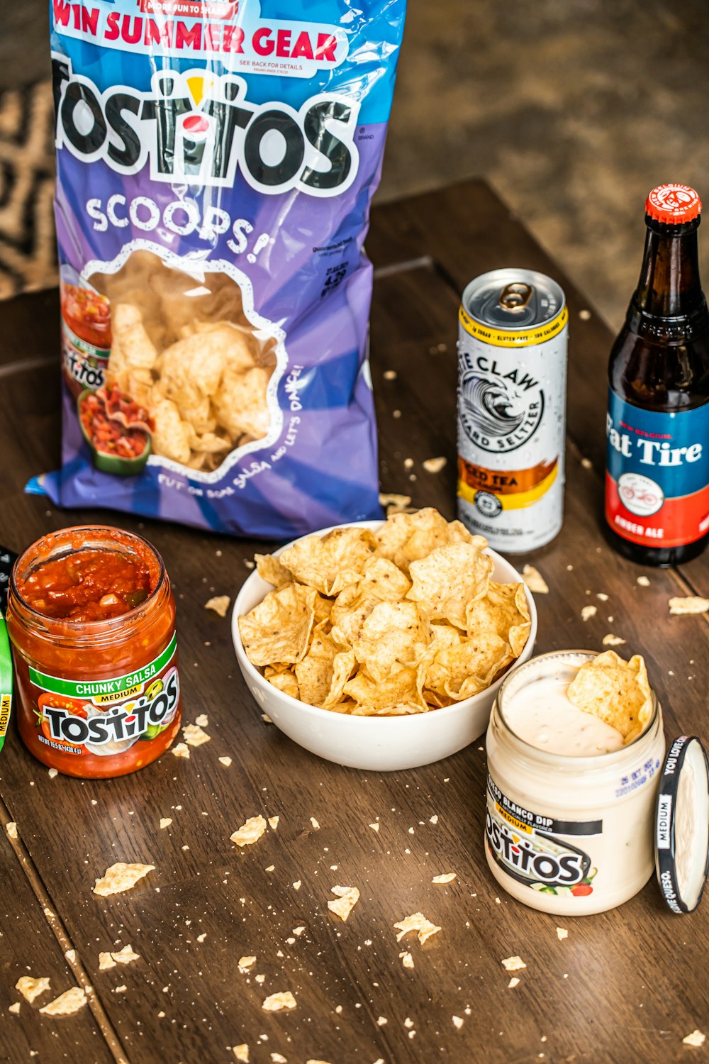 brown glass bottle beside white ceramic bowl with chips