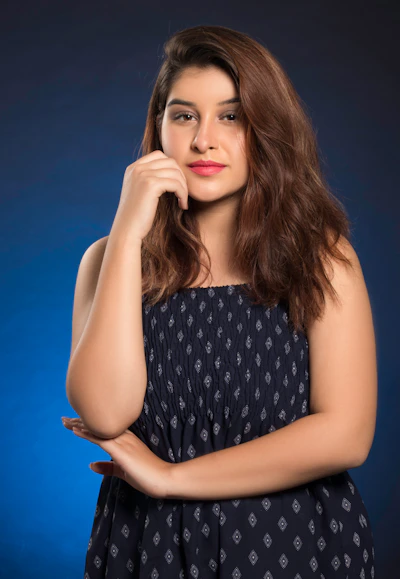 woman in black and white polka dot sleeveless dress
