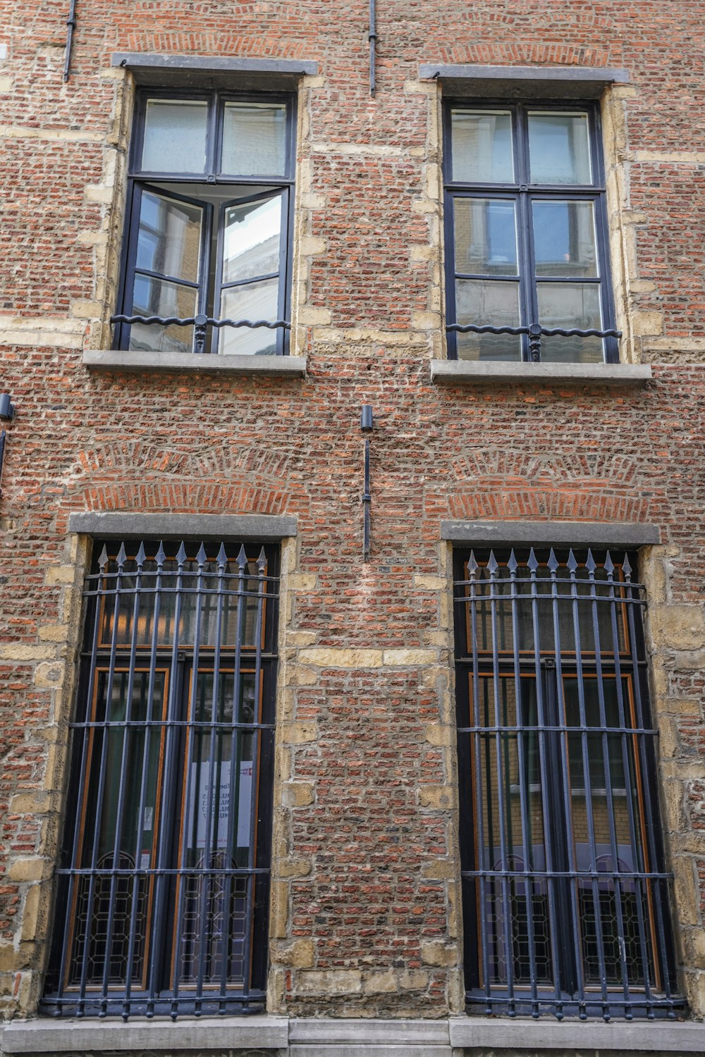 brown brick building with windows