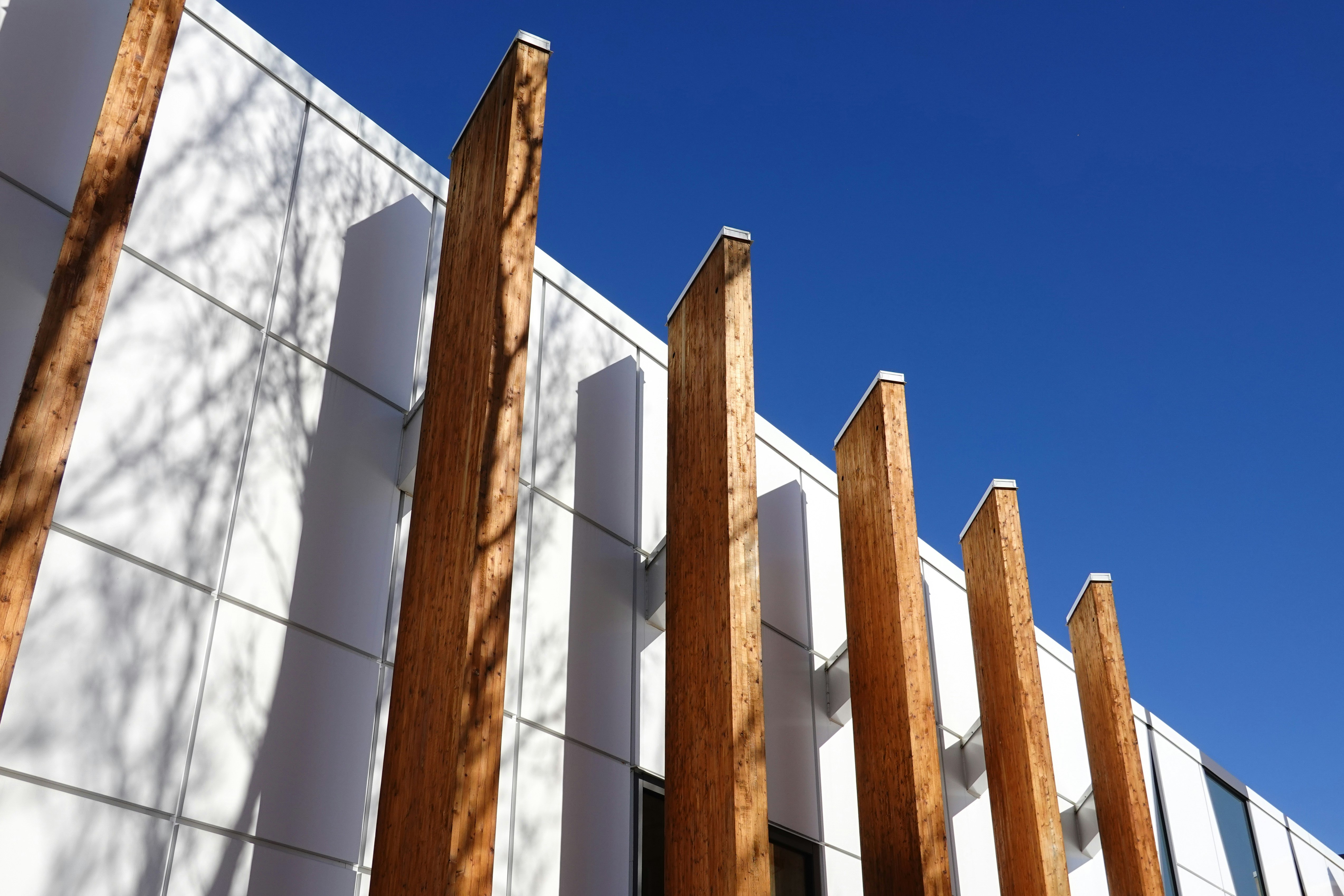white and brown concrete building under blue sky during daytime