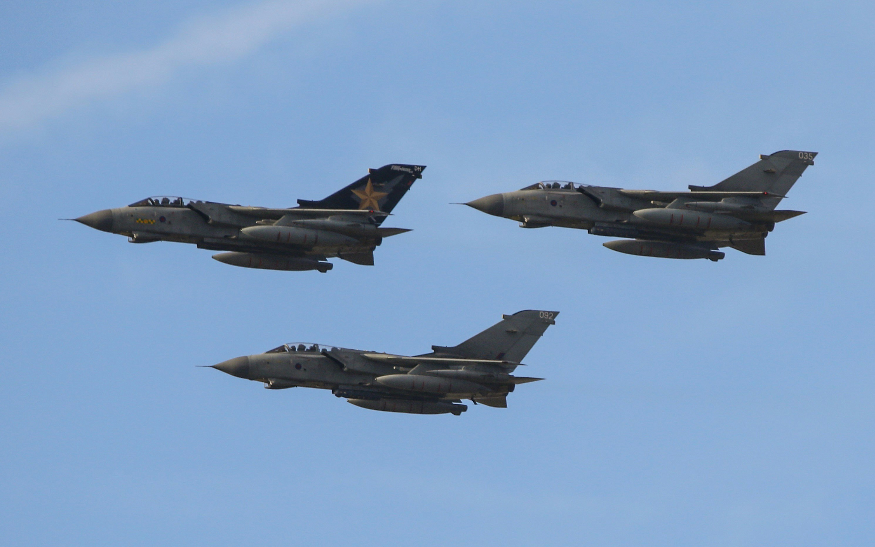 black fighter jet in mid air during daytime