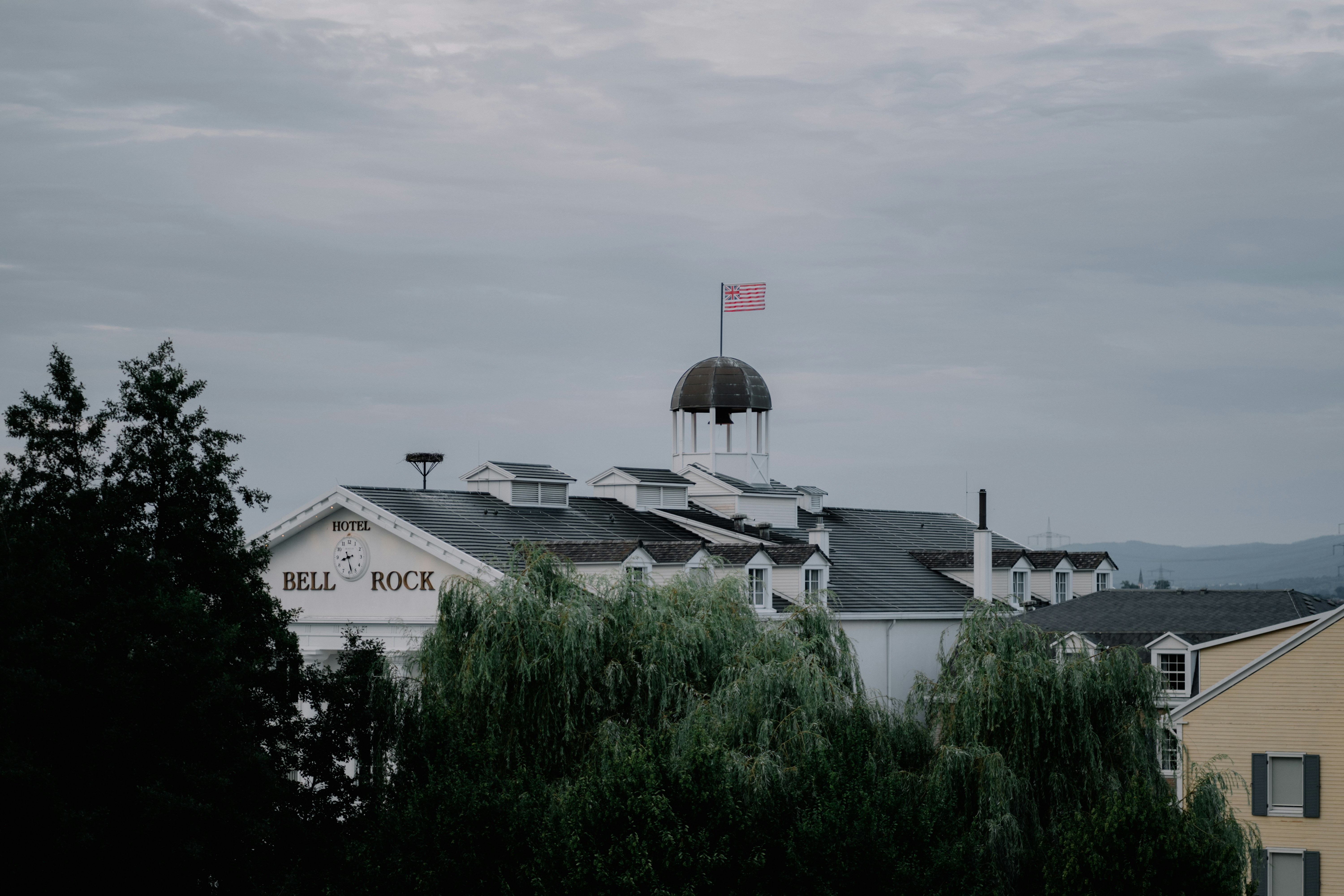 white and gray house under white sky during daytime