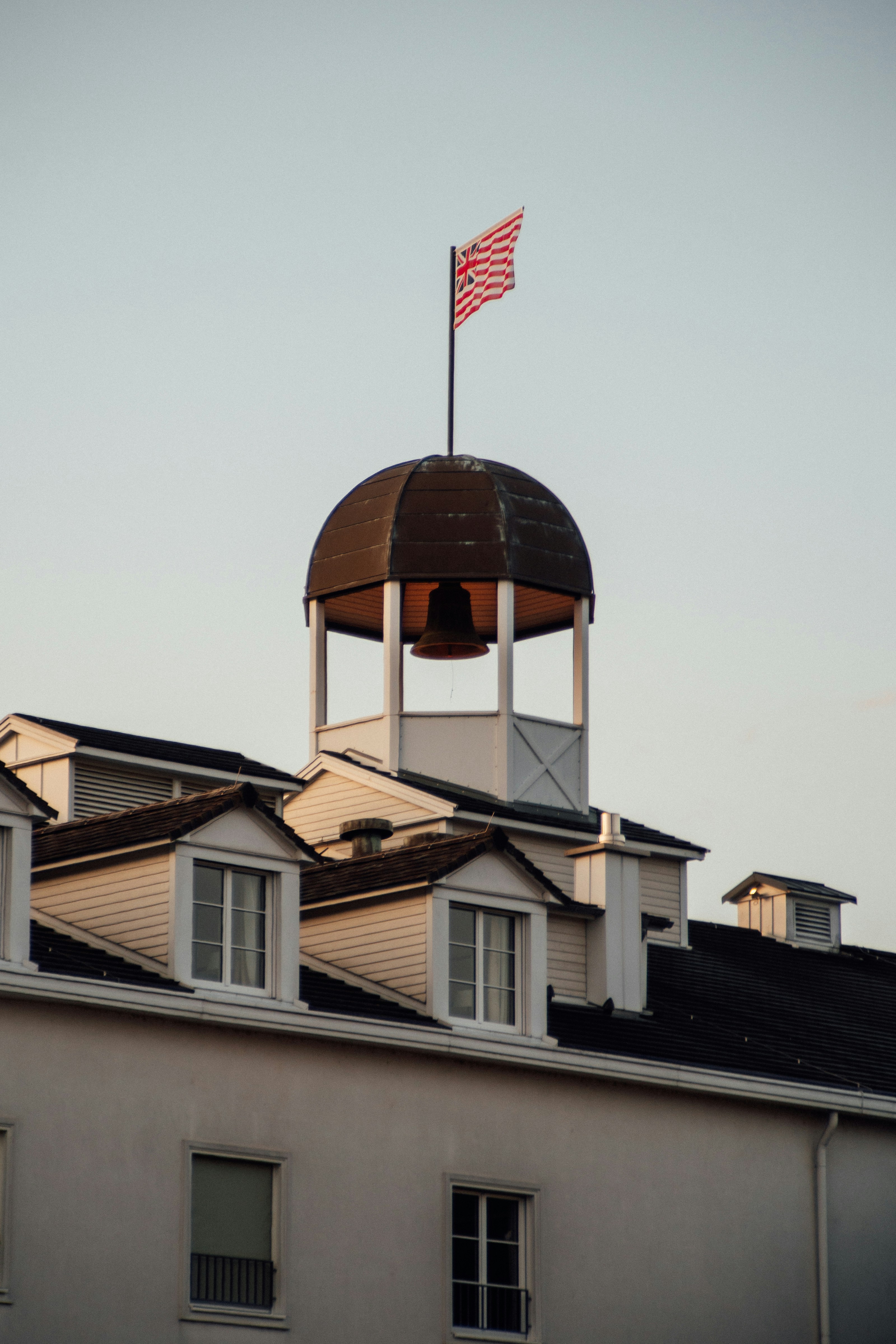 brown and white wooden house under white sky during daytime