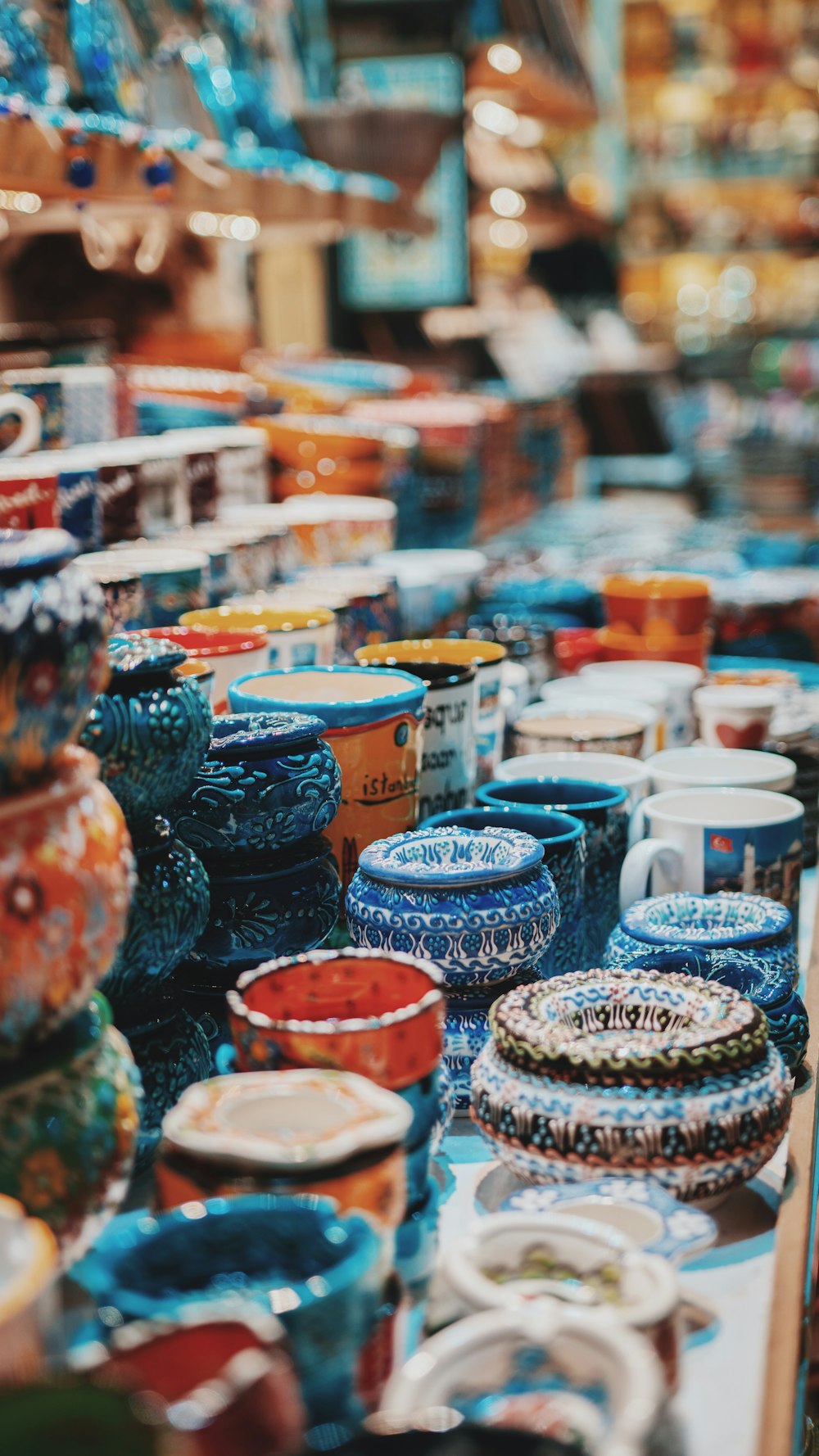 blue and orange ceramic jar