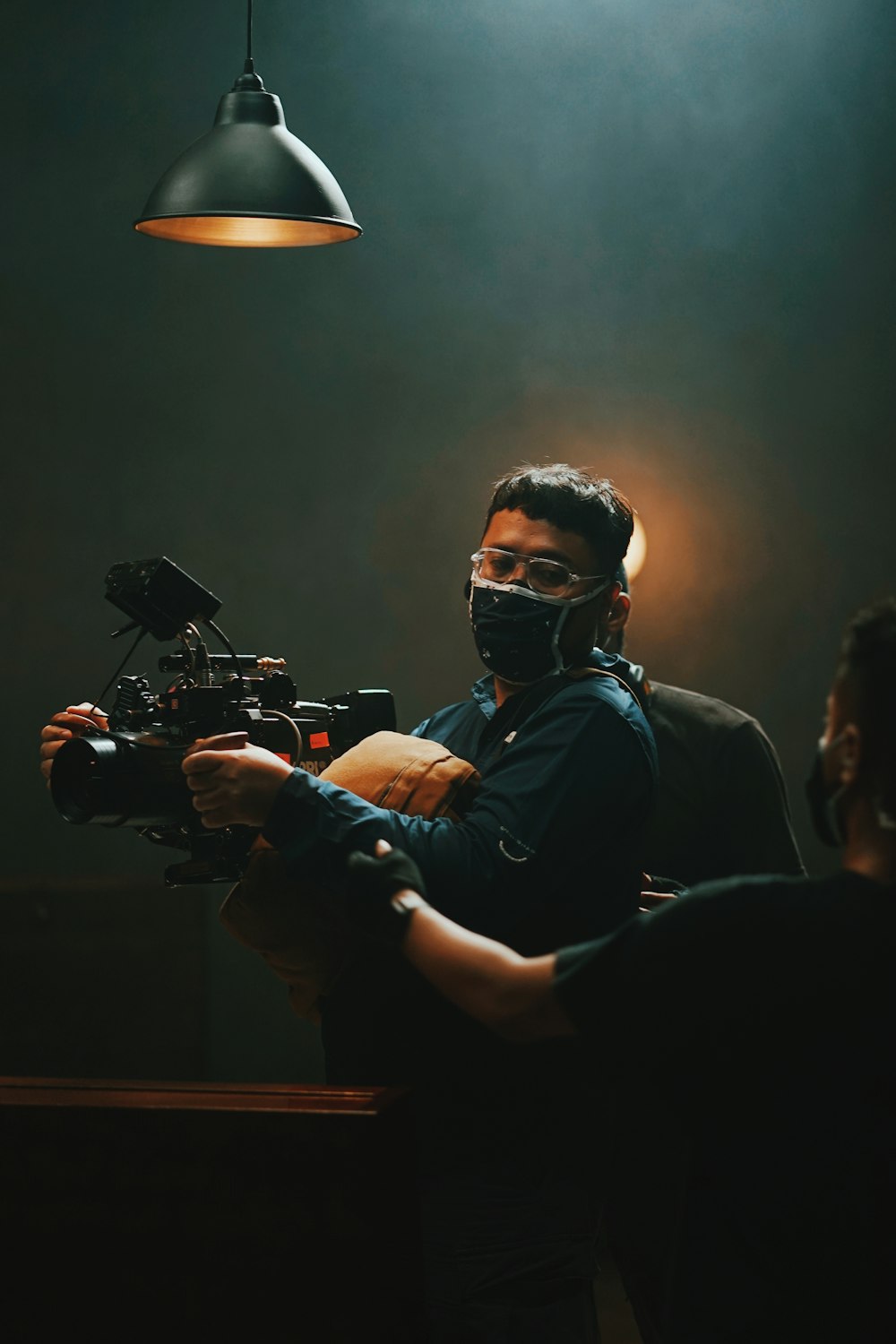 man in black shirt wearing black goggles