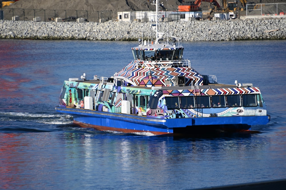 blue and white boat on water during daytime