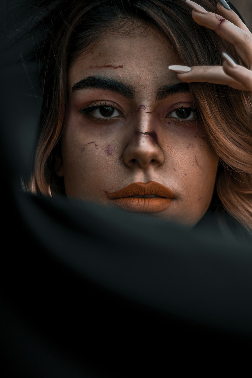 woman with brown hair and black eyes