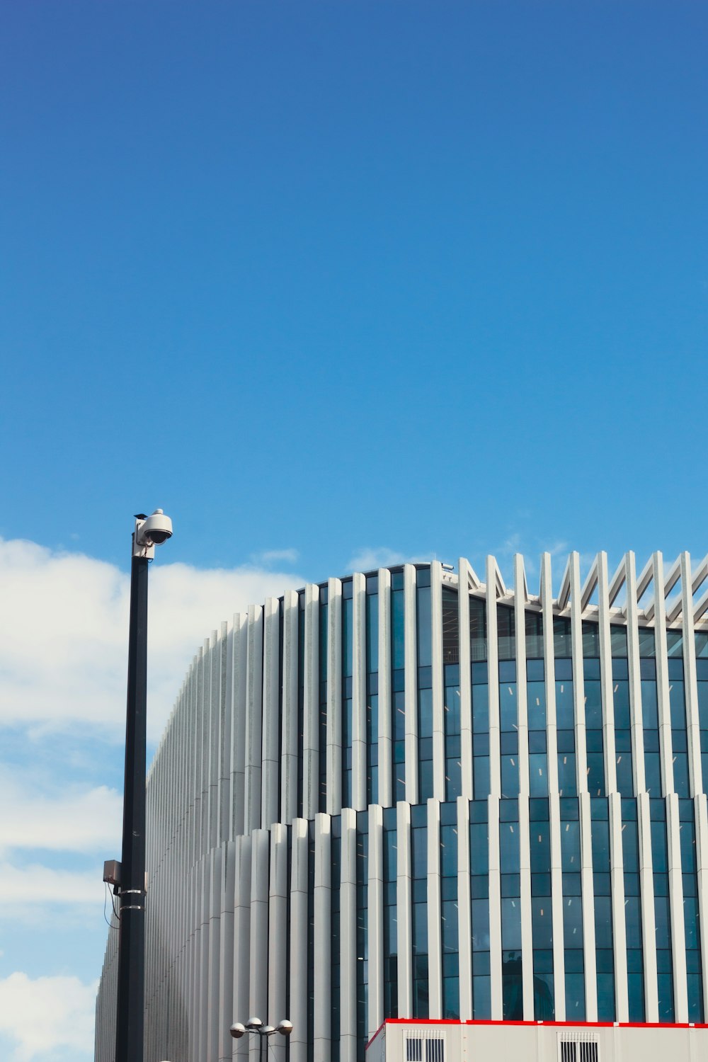 white metal fence under blue sky during daytime