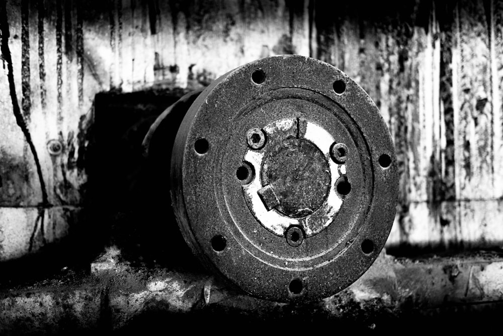 grayscale photo of round metal tool