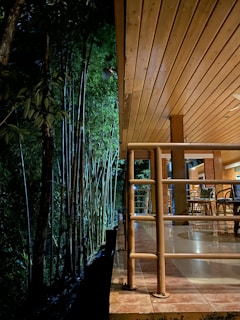 Guests enjoying a peaceful morning on the bamboo deck overlooking the garden.