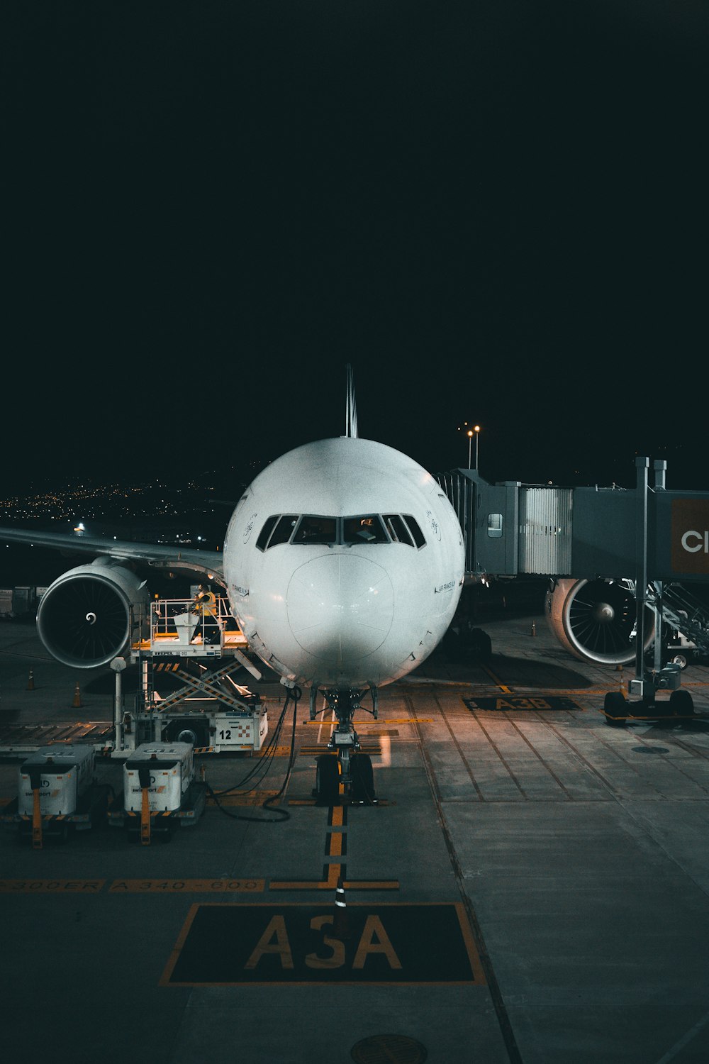 white airplane on airport during night time