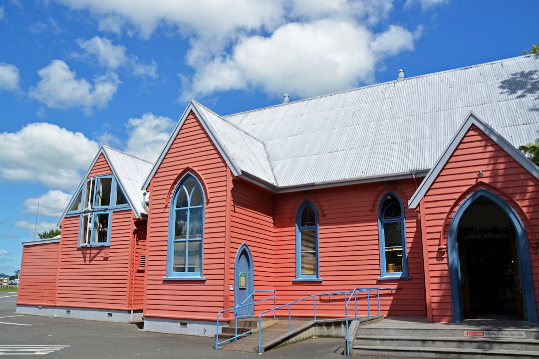 white and red wooden house under blue sky during daytime
