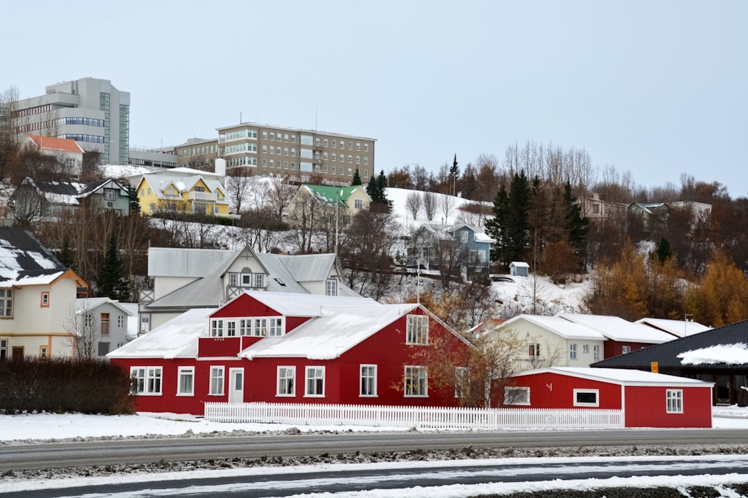 red and white house near road during daytime