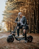 woman in black jacket riding on black motorcycle