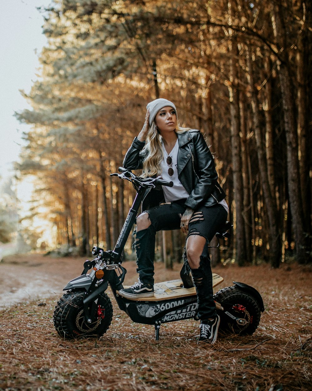 woman in black jacket riding on black motorcycle