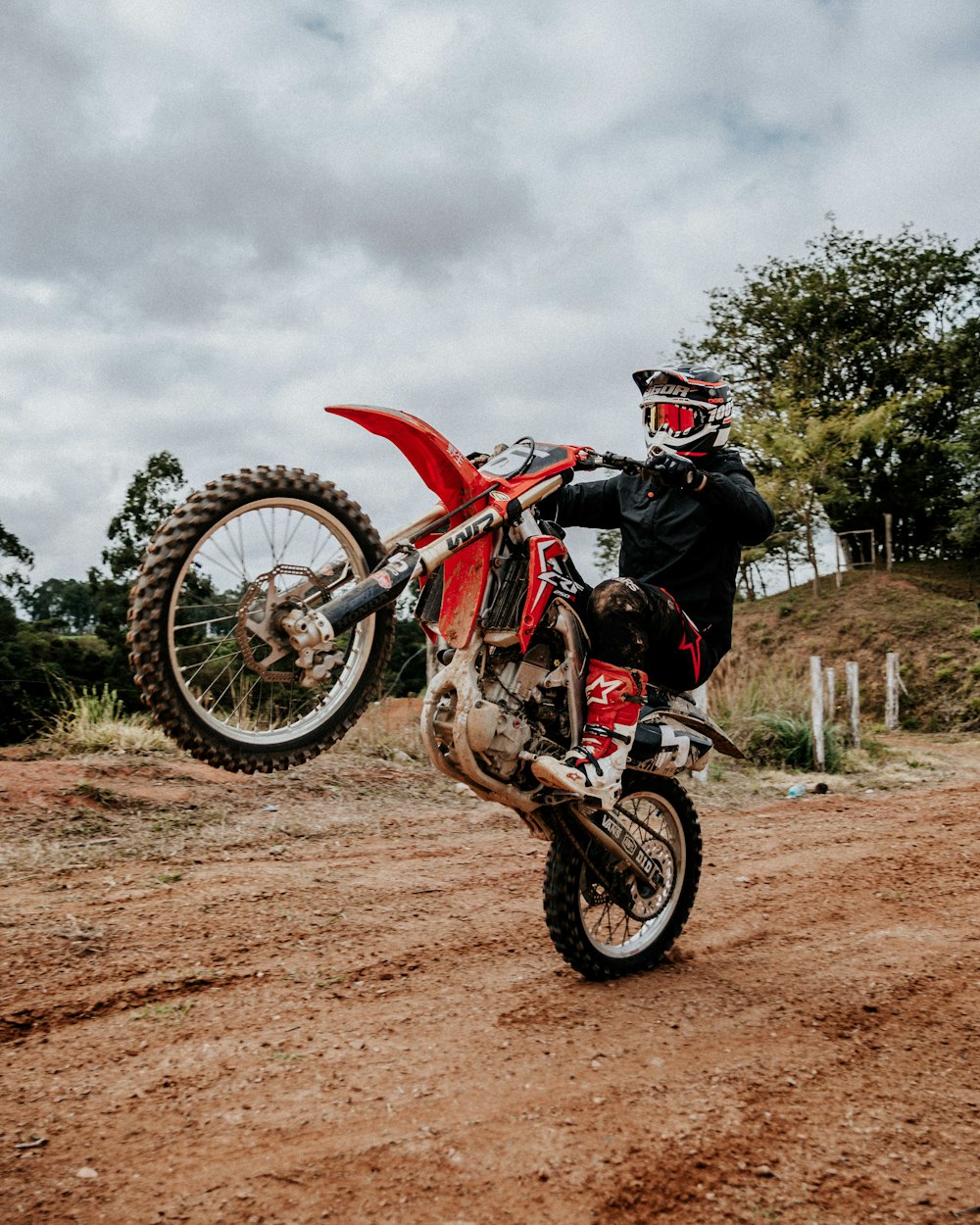 red and black motocross dirt bike