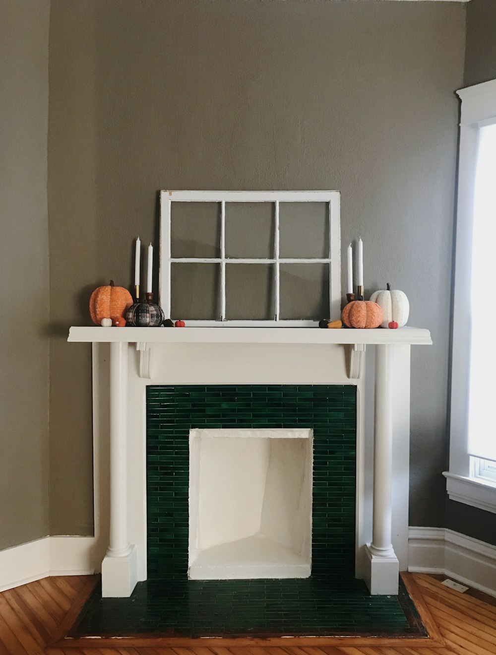 white fireplace with white wooden frame