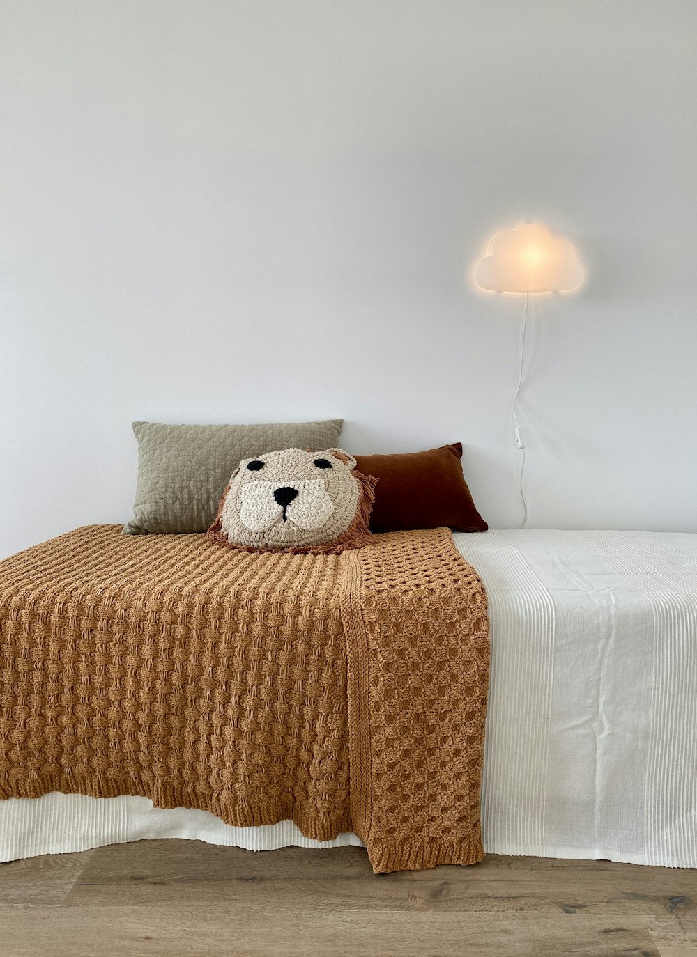 white and red throw pillows on white bed